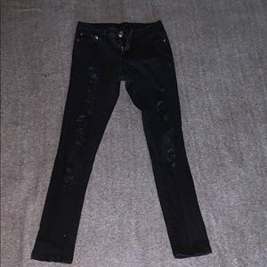 Black mid rise ripped jeans